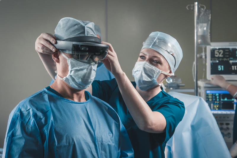 A surgeon wearing AR glasses